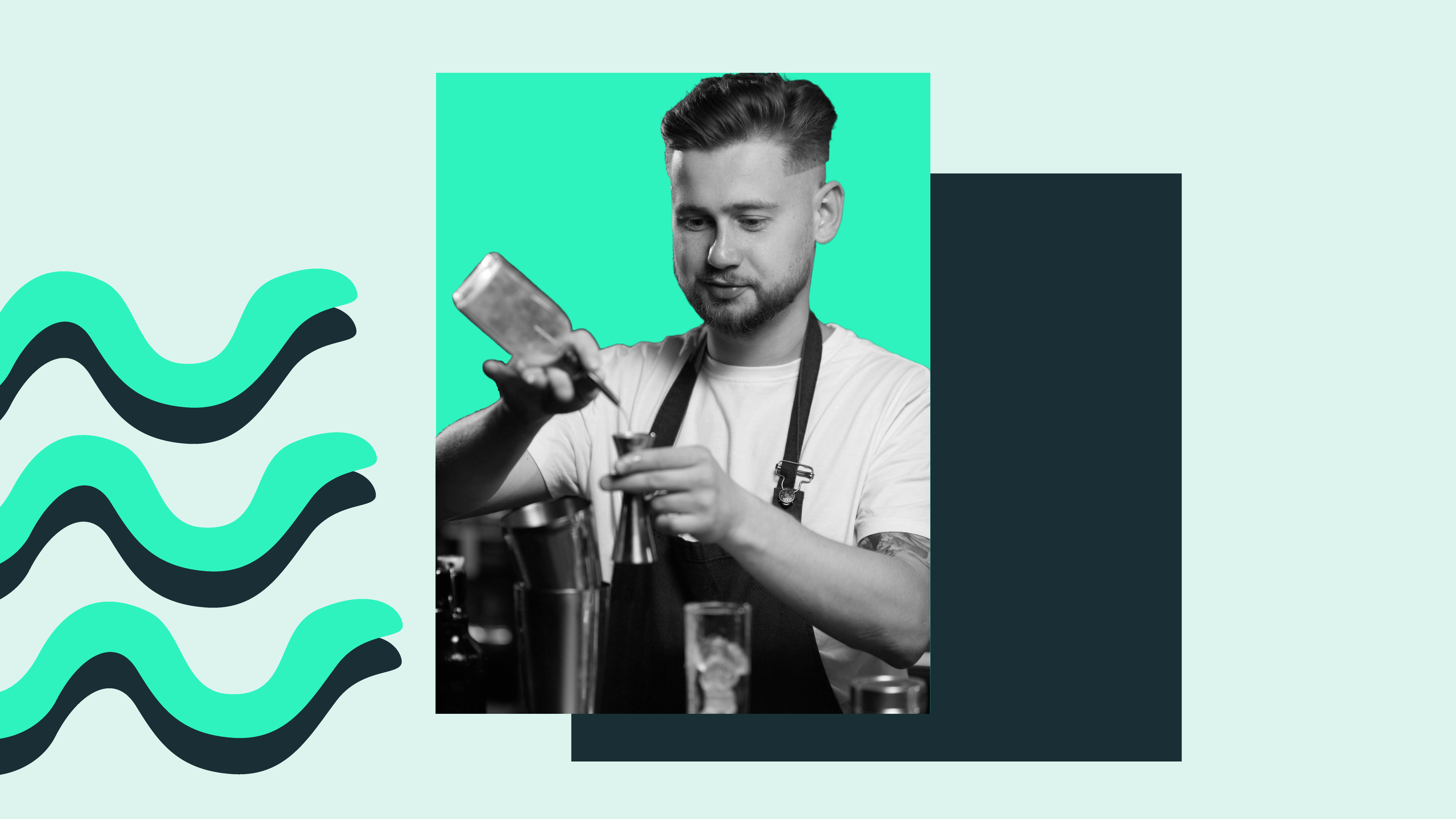 A man makes a cocktail in his role as a bartender